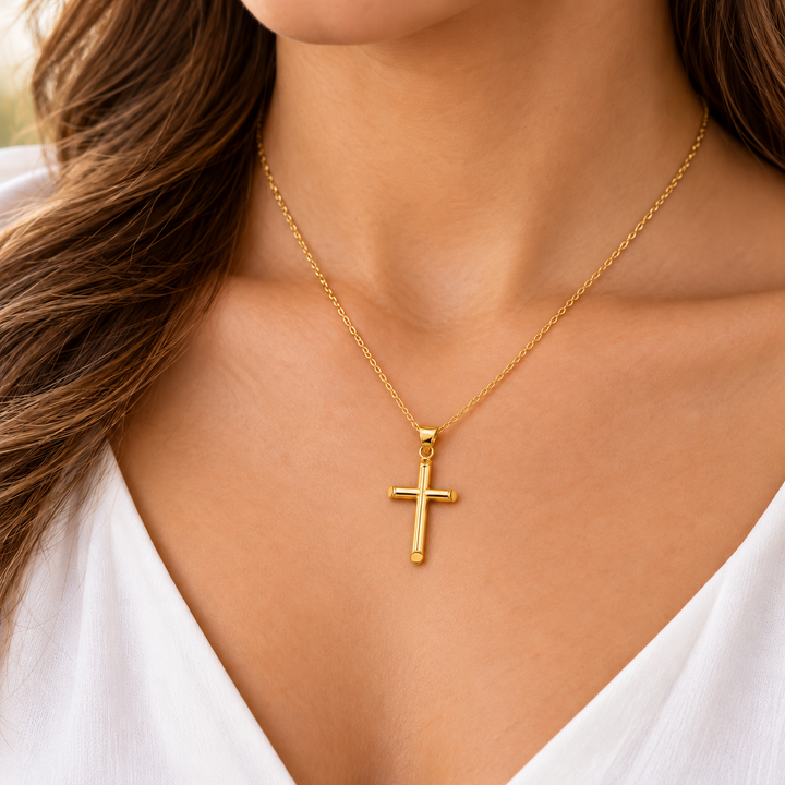 LSJ-PT16 14K yellow gold plain medium cross pendant worn on a model