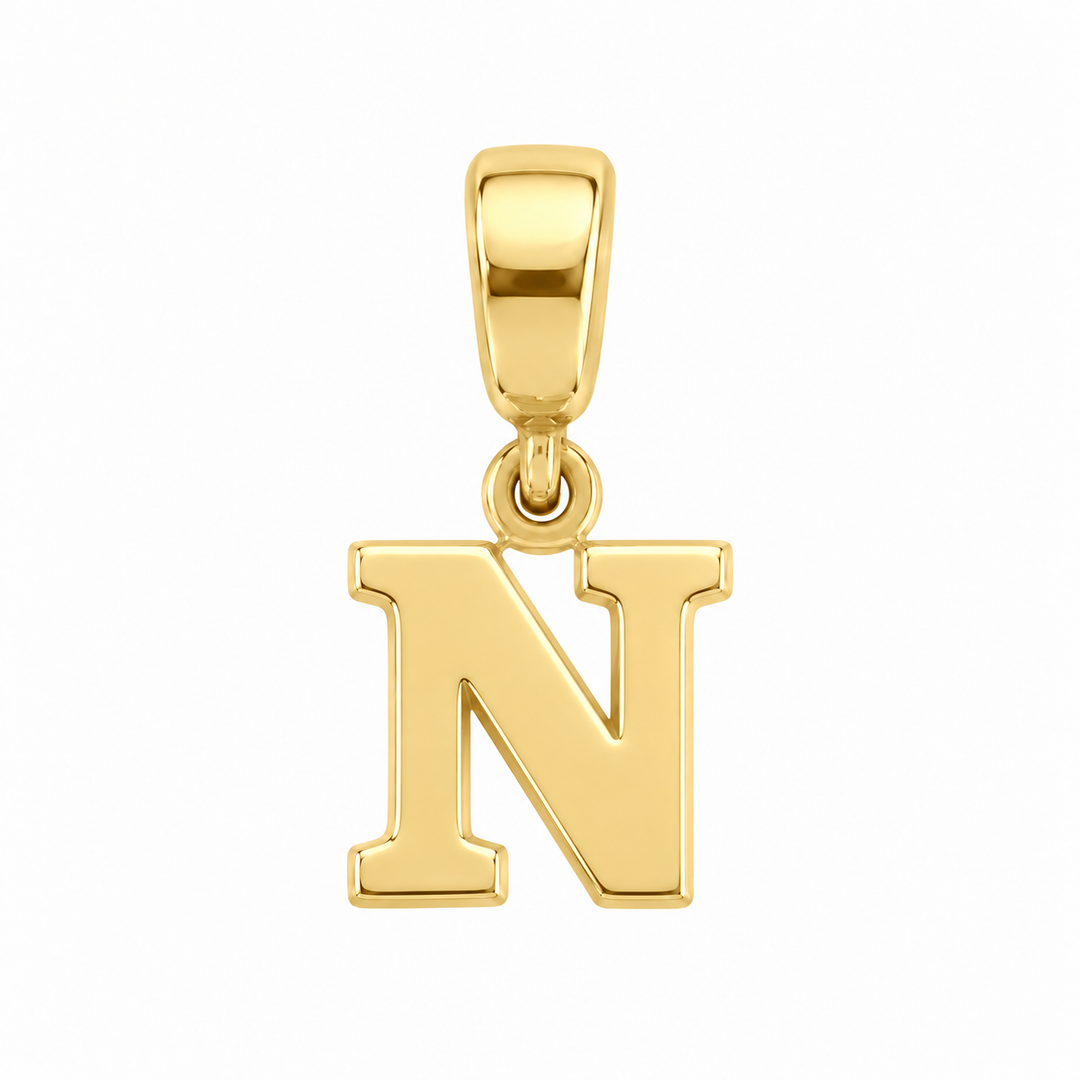 14K yellow gold initial N charm pendant on white background