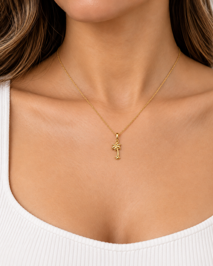 14K Yellow Gold Palm Tree Pendant on female model, petite scale
